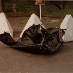 The ripped-off roof of the passenger car after it hit the barrier.